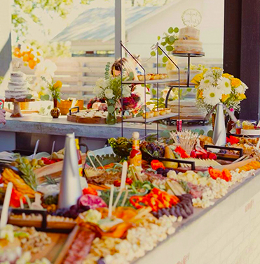 a buffet table filled with lots of food